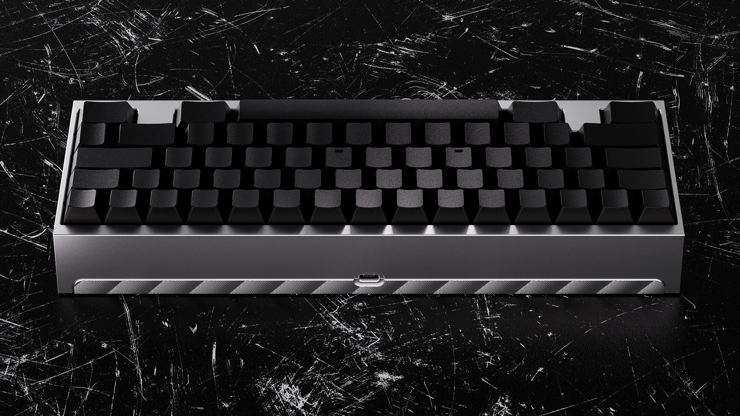 Silver Lyla WKL mechanical keyboard on a black textured surface